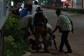 A wounded unidentified person is evacuated following an attack by gunmen on a restaurant in Ouagadougou, Burkina Faso, in this still frame taken from video August 13, 2017. REUTERS/Reuters TV TPX IMAGES OF THE DAY