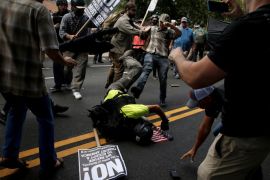 Counter demonstrators attack a white supremacist during a rally in Charlottesville, Virginia, U.S., August 12, 2017. REUTERS/Joshua Roberts