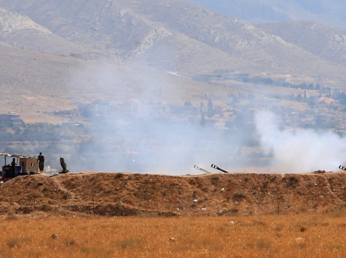 Lebanese army military tanks fire during an offensive near Ras Baalbek, Lebanon August 19, 2017. REUTERS/Ali Hashisho