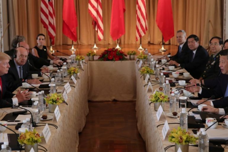 U.S. President Donald Trump (2nd L) holds a bilateral meeting with China's President Xi Jinping (R) at Trump's Mar-a-Lago estate in Palm Beach, Florida, U.S., April 7, 2017. REUTERS/Carlos Barria