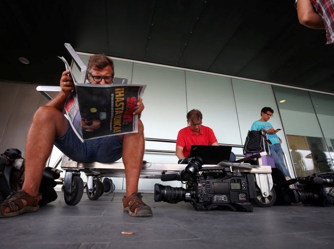 Journalists and tv crews wait outside an airport terminal for Brazilian soccer player Neymar after Spain's La Liga rejected a payment of a record-breaking release clause that would allow him to leave Barcelona for Paris St Germain, in Barcelona, Spain August 3, 2017. REUTERS/Albert Gea