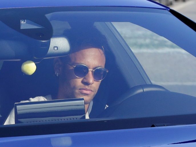 Brazilian soccer player Neymar drives to arrive to Joan Gamper training camp near Barcelona, Spain, August 2, 2017. REUTERS/Stringer