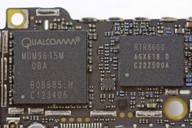 Handout image released by iFixit.com shows the Qualcomm MDM9615M chip on a board of a new iPhone 5 in Melbourne, Australia September 21, 2012. iPhone 5 hit stores around the globe on Friday, with fans snapping up the device that is expected to fuel a huge holiday quarter for the consumer giant. REUTERS/iFixIt.com/Handout (AUSTRALIA - Tags: BUSINESS SCIENCE TECHNOLOGY SOCIETY) FOR EDITORIAL USE ONLY. NOT FOR SALE FOR MARKETING OR ADVERTISING CAMPAIGNS. THIS IMAGE HAS BEEN SUPPLIED BY A THIRD PARTY. IT IS DISTRIBUTED, EXACTLY AS RECEIVED BY REUTERS, AS A SERVICE TO CLIENTS. MANDATORY CREDIT