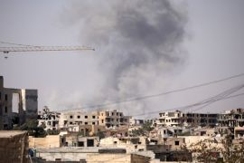 Smoke rises from a building in Raqqa, Syria July 31, 2017.REUTERS/ Rodi Said