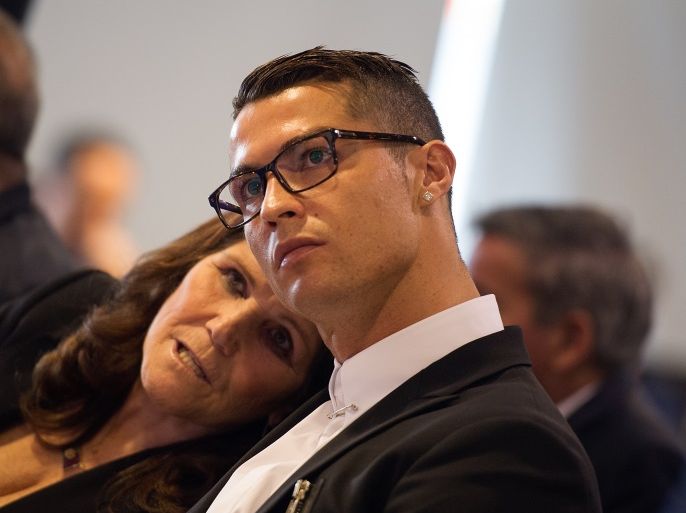 MADRID, SPAIN - NOVEMBER 07: Cristiano Ronaldo of Real Madrid looks on with his mother Maria Dolores dos Santos Aveiro during his press conference after signing a new five-year contract with the Spanish club at the Santiago Bernabeu stadium on November 7, 2016 in Madrid, Spain. (Photo by Denis Doyle/Getty Images)
