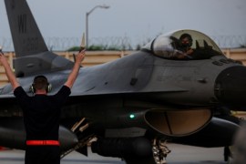 A U.S. Air Force Airman marshals an F-16 Fighting Falcon jet after it arrived for a deployment by the 176th Fighter Squadron, 115th Fighter Wing, Wisconsin Air National Guard at Kunsan Air Base, South Korea, August 3, 2017. Picture taken August 3, 2017. U.S. Air Force/Staff Sgt. Victoria H. Taylor/Handout via REUTERS. ATTENTION EDITORS - THIS IMAGE WAS PROVIDED BY A THIRD PARTY