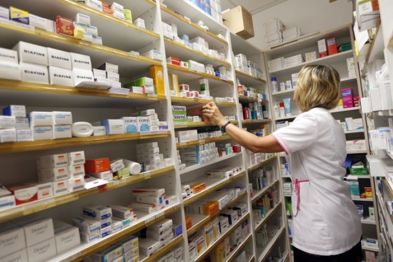 A pharmacist selects drugs inside her pharmacy in Bordeaux, France, September 15, 2015. REUTERS/Regis Duvignau