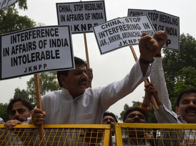 Indian activists of Natinal Panthers Party shout anti Chinese slogans during a protest near the Chinese embassy in New Delhi on July 7, 2017.China has warned that the withdrawal of Indian troops from disputed territory was a precondition for peace as tensions rise in a border row between the two Asian powers that has drawn in tiny Bhutan. / AFP PHOTO / Money SHARMA (Photo credit should read MONEY SHARMA/AFP/Getty Images)
