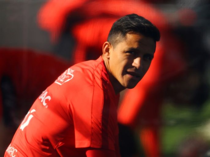 Soccer Football - Chile's national soccer team training session - World Cup 2018 Qualifiers - Santiago, Chile - August 29, 2017 - Chilean national soccer team player Alexis Sanchez attends a training session ahead of their match against Paraguay. Picture taken through a plastic tent. REUTERS/Ivan Alvarado