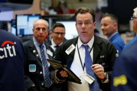 Traders work on the floor of the New York Stock Exchange (NYSE) in New York, U.S., August 17, 2017. REUTERS/Brendan McDermid