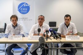 Chief surgeon doctor Denis Corcella, flanked by assistant surgeons Billy Chedal Bornu (L) and Mickael Bouyer (R) holds a press conference at the Grenoble hospital, on August 25, 2017, following the France's first reimplantation of a woman's two arms.A 30-year-old woman was operated two hours after her arms were amputated in a train accident. The medical staff of the hand surgery service, 'performed the first successful bilateral and simultaneous arms reimplantation in France,' said the Grenoble University Hospital Centre on August 24, 2017. / AFP PHOTO / PHILIPPE DESMAZES (Photo credit should read PHILIPPE DESMAZES/AFP/Getty Images)