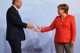 German Chancellor Angela Merkel greets Turkey's President Recep Tayyip Erdogan at the beginning of the G20 summit in Hamburg, Germany, July 7, 2017. REUTERS/Bernd Von Jutrczenka/POOL
