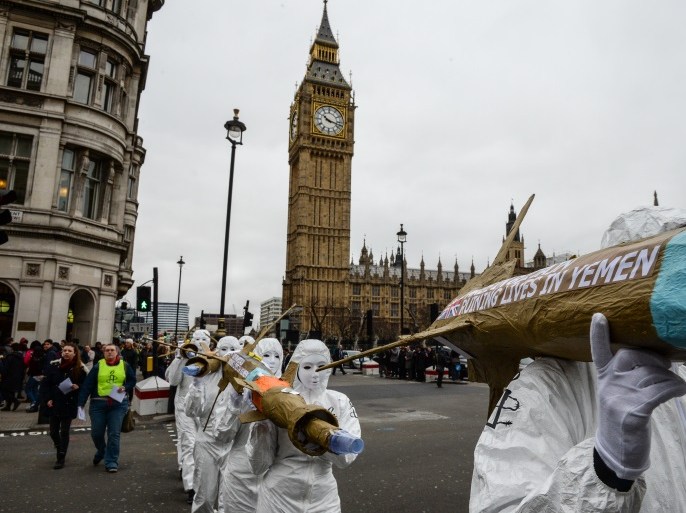 LONDON, ENGLAND - MARCH 18: Amnesty International activists march with homemade replica missiles bearing the message 'Made in Britain, destroying lives in Yemen' past Parliament and towards Downing Street during a protest over UK arms sales to Saudi Arabia on March 18, 2016 in London, England. The missiles are replicas of the 500lb 'Paveway-IV' weapon which are currently used by Saudi Arabia's UK supplied Eurofighter Typhoon war planes. (Photo by Chris Ratcliffe/
