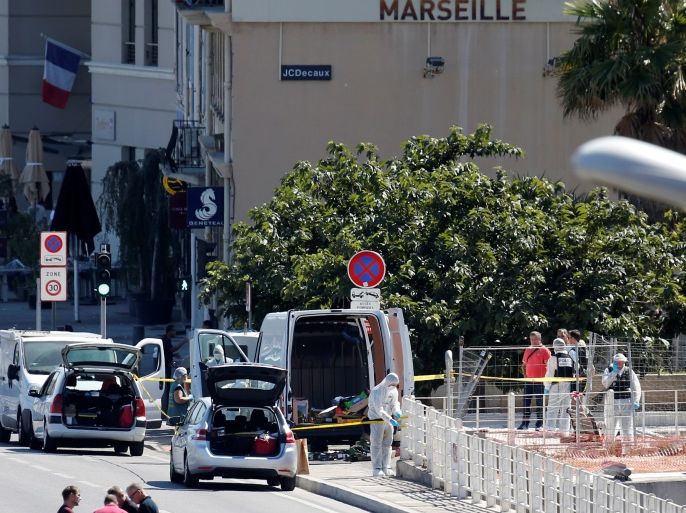 French police conduct their investigation in the French port city of Marseille after one person was killed and another injured after a vehicle crashed into two bus shelters, in Marseille, France, August 21, 2017. REUTERS/Philippe Laurenson