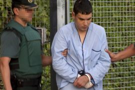 Mohamed Houli Chemlal, suspected of involvement in the terror cell that carried out twin attacks in Spain, is escorded by Spanish Civil Guards from a detention center in Tres Cantos, near Madrid, on August 22, 2017 before being tranferred to the. National CourtUnder heavy security, police vans entered the National Court, which deals with terrorism cases, where a judge will question them and decide what -- if any -- charges to press against them over the vehicle attacks