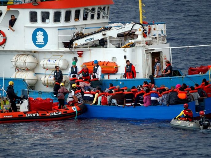 Migrants on a wooden boat are rescued by German NGO Jugend Rettet ship