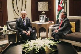 In this photo released by the Jordanian Royal Palace,Israeli Prime Minister Benjamin Netanyahu and Jordanian King Abdullah II meet in Amman, Jordan, Thursday, Nov. 13, 2014. The meeting was to discuss ways to restore unrest in Jerusalem. Kerry met earlier Thursday with Jordanian Foreign Minister Nasser Judeh and with Palestinian President Mahmoud Abbas. Abbas didn't join the trilateral discussion on Thursday evening. (AP Photo/Jordanian Royal Palace, Yousef Allan)