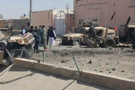 Afghan security personnel inspect the site of a suicide attack near the main police headquarters in Lashkar Gah, capital of Helmand province, on August 23, 2017.A Taliban suicide bomber killed five people and wounded dozens of others, mainly children as young as five, when he detonated a car packed with explosives at a police headquarters in southern Afghanistan on August 23. / AFP PHOTO / STR (Photo credit should read STR/AFP/Getty Images)