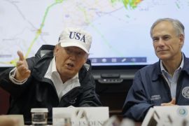 U.S. President Donald Trump receives a briefing on Tropical Storm Harvey relief efforts with Texas Governor Greg Abbott (R) at the Texas Department of Public Safety Emergency Operations Center in Austin, Texas, U.S., August 29, 2017. REUTERS/Carlos Barria
