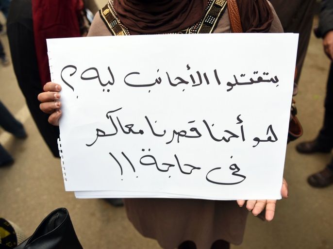 A woman holds a placard reading in Arabic 'Why did you kill foreigners ? Did he do something to you ?' during a rally in memory of Italian student Giulio Regeni on February 6, 2016, outside of the Italian embassy in the Egyptian capital Cairo.The 28-year-old student who disappeared in Cairo last week has been found dead and appears to have been tortured, officials said on February 4, prompting furious demands from Rome for the speedy arrest of his killers. / AFP / MOHAMED EL-SHAHED (Photo credit should read MOHAMED EL-SHAHED/AFP/Getty Images)