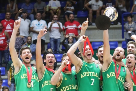 Australia celebrates their Gold Medal after defeating Iran during their 2017 FIBA Asia Cup final basketball match, in the Lebanese town of Zouk Mikael north of Beirut on August 20, 2017. / AFP PHOTO / STR (Photo credit should read STR/AFP/Getty Images)