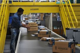 An Indian employee works inside Amazon's largest Fulfillment Centre (FC) in India, on the outskirts of Hyderabad on September 7, 2017. / AFP PHOTO / NOAH SEELAM (Photo credit should read NOAH SEELAM/AFP/Getty Images)