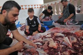 Palestinian men divide meat after slaughtering a bull at a residence in Rafah in the southern Gaza Strip, on September 1, 2017, as part of the commemoration for the first day of Eid al-Adha.Eid al-Adha (the Festival of Sacrifice) is celebrated throughout the Muslim world as a commemoration of Abraham's willingness to sacrifice his son for God, and cows, camels, goats and sheep are traditionally slaughtered on the holiest day. / AFP PHOTO / SAID KHATIB (Photo credit should read SAID KHATIB/AFP/Getty Images)