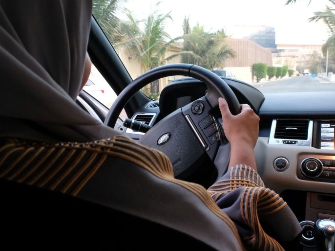 A Saudi woman drives her car along a street in the Saudi coastal city of Jeddah, on September 27, 2017. Saudi Arabia will allow women to drive from next June, state media said on September 26, 2017 in a historic decision that makes the Gulf kingdom the last country in the world to permit women behind the wheel. / AFP PHOTO / REEM BAESHEN (Photo credit should read REEM BAESHEN/AFP/Getty Images)