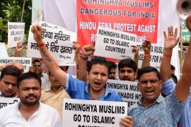 Indian activists from the right-wing organization Hindu Sena hold placards as they shout slogans against Rohingya Muslim refugees being granted asylum in India, in New Delhi on September 11, 2017.The number of Rohingya who have fled violence in Myanmar's Rakhine state and entered Bangladesh since August 25 has reached 313,000, a UN spokesman said on September 11. / AFP PHOTO / SAJJAD HUSSAIN (Photo credit should read SAJJAD HUSSAIN/AFP/Getty Images)