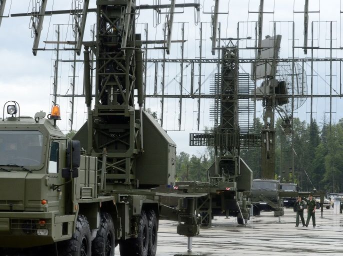 Russian Army officers pass radar systems on display at the Army-2015 international military forum in Kubinka, outside Moscow, on June 16, 2015. AFP PHOTO / VASILY MAXIMOV (Photo credit should read VASILY MAXIMOV/AFP/Getty Images)