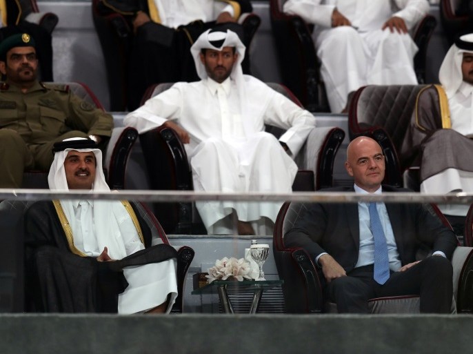 Qatar's Emir Sheikh Tamim Bin Hamad Al-Thani and FIFA President Gianni Infantino watch final soccer match of the Qatar Emir Cup, at the Khalifa International Stadium in Doha, Qatar, May 19, 2017. Picture taken May 19, 2017. REUTERS/Ibraheem Al Omari