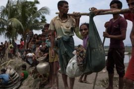 WHAIKHYANG, BANGLADESH - SEPTEMBER 07: Rohingya Muslim refugees wait to board boats over a creek after crossing the Myanmar Bangladesh border on September 07, 2017 in Whaikhyang, Bangladesh. Thousands of Rohingya continue to cross the border after violence erupted in Myanmar's Rakhine state when the country's security forces allegedly launched an operation against the Rohingya Muslim community. (Photo by Dan Kitwood/Getty Images)