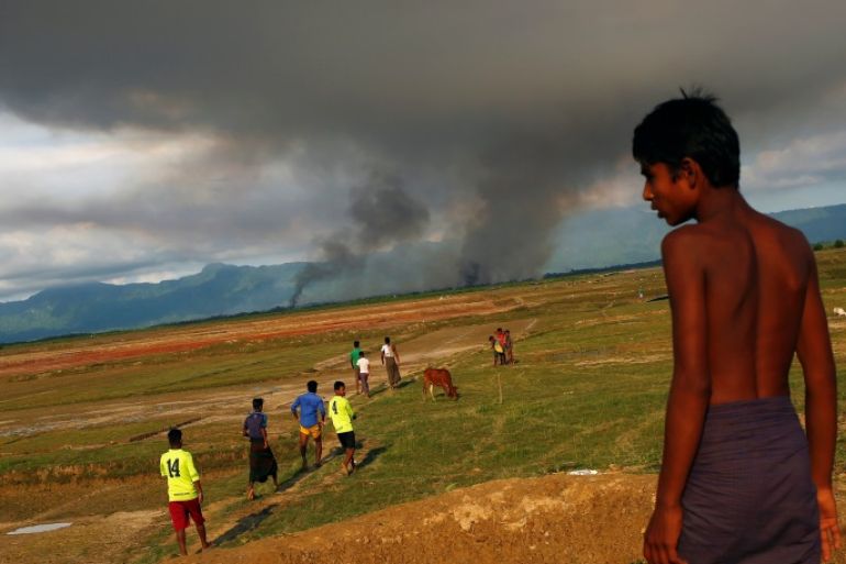 A large plume of smoke is seen on the Myanmar side of the border from Teknaf, Bangladesh September 15, 2017. REUTERS/Mohammad Ponir Hossain