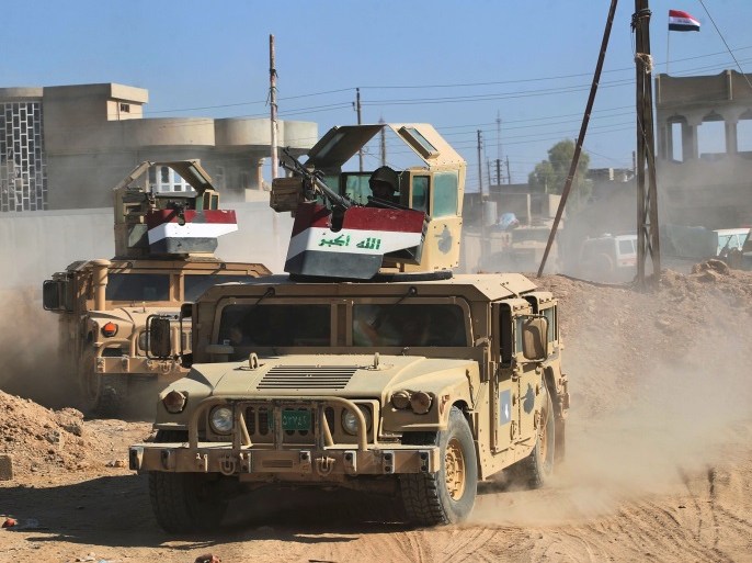 Humvees of the combined Iraqi forces and Hashed Al-Shaabi (Popular Mobilization units) advance through the town of Tal Afar, west of Mosul, after the Iraqi government announced the launch of the operation to retake it from Islamic State (IS) group control, on August 26, 2017. / AFP PHOTO / AHMAD AL-RUBAYE (Photo credit should read AHMAD AL-RUBAYE/AFP/Getty Images)