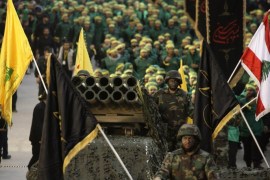 Members of Lebanon's militant Shiite Muslim movement Hezbollah stand on a pick-up truck mounted with a multiple rocket launcher as they take part in a parade in the southern city of Nabatiyeh on November 7, 2014, to mark the 13th day of Ashura, where believers mourn the killing of the Prophet Mohammed's grandson, Imam Hussein, during the battle of Karbala in central Iraq in the seventh century. AFP PHOTO / MAHMOUD ZAYYAT (Photo credit should read MAHMOUD ZAYYAT/AFP/Getty Images)