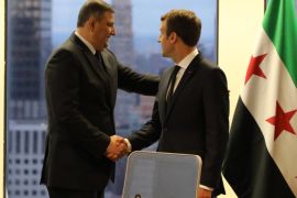 France's President Emmanuel Macron (R) shakes hands with chief negotiator for the Syrian opposition, Riyad Hijab, at the French mission at the United Nations in New York on September 18, 2017, on the sidelines of UN General Assembly. / AFP PHOTO / LUDOVIC MARIN (Photo credit should read LUDOVIC MARIN/AFP/Getty Images)