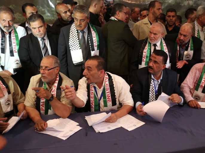 Members of the Palestinian National Reconciliation Committee attend a ceremony at which 14 families who lost relatives in fighting between rival Palestinian factions Hamas and Fatah in 2007 are to receive compensation, in Gaza City on September 14, 2017. / AFP PHOTO / SAID KHATIB (Photo credit should read SAID KHATIB/AFP/Getty Images)