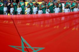 Football Soccer - African Cup of Nations - Quarter Finals - Egypt v Morocco- Stade de Port Gentil - Gabon - 29/1/17. Morocco's national soccer team players listen to the national anthem behind the national flag ahead of the match. REUTERS/Amr Abdallah Dalsh