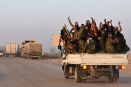 Syrian pro-government forces flash the sign for victory in the back of vehicle on the outskirts of the eastern city of Deir Ezzor on September 10, 2017, as they continue to press forward with Russian air cover in the offensive against Islamic State group jihadists across the province. / AFP PHOTO / George OURFALIAN (Photo credit should read GEORGE OURFALIAN/AFP/Getty Images)