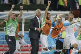 Algeria's coach Vahid Halilhodzic (2nd L) celebrates with team players after the match against Russia at the 2014 World Cup Group H soccer match at the Baixada arena in Curitiba June 26, 2014. REUTERS/Henry Romero (BRAZIL - Tags: SOCCER SPORT WORLD CUP)