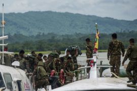 Myanmar soldiers arrive at Buthidaung jetty in Myanmar's Rakhine State on August 29, 2017.Rohingya Muslims are once more fleeing in droves towards Bangladesh, trying to escape the latest surge in violence in Rakhine state between a shadowy militant group and Myanmar's military. / AFP PHOTO / STR (Photo credit should read STR/AFP/Getty Images)