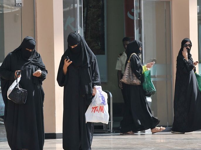 Saudi women leave a shoopping mall on November 7, 2013. Saudi Arabia has the Arab world's largest economy, but the unemployment rate among natives is above 12.5 percent, a figure the government is aiming to reduce. AFP PHOTO/FAYEZ NURELDINE (Photo credit should read FAYEZ NURELDINE/AFP/Getty Images)