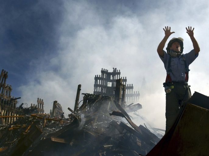 A New York City fireman calls for more rescue workers to make their way into the rubble of the World Trade Center, in this file picture taken September 15, 2001. Al Qaeda leader Osama bin Laden was killed May 1, 2011, in a firefight with U.S. forces in Pakistan and his body was recovered, U.S. President Barack Obama said on May 1, 2011.