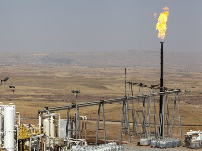 A flame rises from a chimney at Taq Taq oil field in Arbil, in Iraq's Kurdistan region, August 16, 2014. Picture taken August 16, 2014. REUTERS/Azad Lashkari (IRAQ - Tags: ENERGY BUSINESS COMMODITIES)
