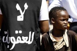 A Sudanese boy demonstrates outside the US embassy in the capital Khartoum on November 3, 2015, to protest against sanctions imposed on their country by the United States. Soudan has been under a US trade embargo since 1997 imposed over rights abuses and support for radical Islamist groups in the early 1990s. The writing in Arabic reads: 'No to sanctions' AFP PHOTO / ASHRAF SHAZLY (Photo credit should read ASHRAF SHAZLY/AFP/Getty Images)