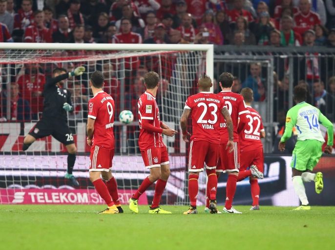 Soccer Football - Bundesliga - FC Bayern Munich vs VfL Wolfsburg - Allianz Arena, Munich, Germany - September 22, 2017 Wolfsburg's Maximilian Arnold scores their first goal from a free kick as Bayern Munich's Sven Ulreich attempts to make a save REUTERS/Michael Dalder DFL RULES TO LIMIT THE ONLINE USAGE DURING MATCH TIME TO 15 PICTURES PER GAME. IMAGE SEQUENCES TO SIMULATE VIDEO IS NOT ALLOWED AT ANY TIME. FOR FURTHER QUERIES PLEASE CONTACT DFL DIRECTLY AT + 49 69 650050