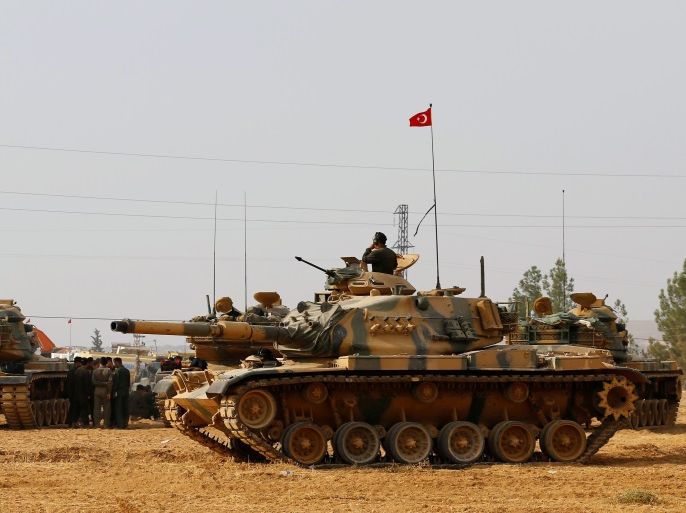 Turkish army tanks and military personal are stationed in Karkamis on the Turkish-Syrian border in the southeastern Gaziantep province, Turkey, August 25, 2016. REUTERS/Umit Bektas/File Photo