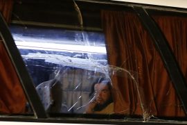 A member of the Islamic State (IS) group looks out of the window of a bus in the Qara area in Syria's Qalamoun region on August 28, 2017 as IS members and their families are transported to Deir Ezzor under part of an unprecedented deal to end three years of jihadist presence.Under the evacuation deal, several hundred jihadists and their families on both sides of the border are set to leave by bus for Deir Ezzor in eastern Syria, the country's only province still under IS control. / AFP PHOTO / LOUAI BESHARA (Photo credit should read LOUAI BESHARA/AFP/Getty Images)