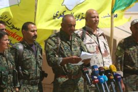 Ahmad Abu Khawlah (3rd-R), chief of the Deir Ezzor Military Council (DEMC) -- a coalition of Arab tribes and fighters that belongs to the broader US-backed Syrian Democratic Forces -- speaks during a press conference in the northeastern Syrian village of Abu Fas, on the southern outskirts of Hasakah province, on September 9, 2017.Abu Khawlah announced the launch of a new offensive to oust the Islamic State (IS) group from swathes of Syria's eastern Deir Ezzor province on September 9, 2017, aiming to clear the jihadists from territory east of the Euphrates River, in addition to the fighting already taking place to retake their de-facto capital in Raqa.Syrian regime forces are also fighting a separate offensive to oust IS from the Deir Ezzor provincial capital. / AFP PHOTO / DELIL SOULEIMAN (Photo credit should read DELIL SOULEIMAN/AFP/Getty Images)