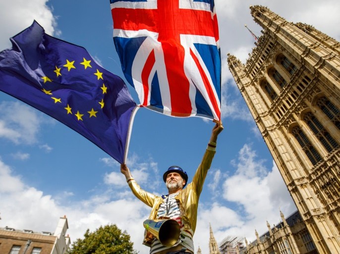 Pro-European Union demonstrators protest outside the Houses of Parliament in central London against the first vote today on a bill to end Britain's membership of the EU on September 11, 2017. MPs hold their first vote today on a bill to end Britain's membership of the EU, which ministers say will avoid a 'chaotic' Brexit but has been condemned as an unprecedented power grab. / AFP PHOTO / AFP PHOTO AND Tolga Akmen / Tolga Akmen (Photo credit should read TOLGA AKMEN/AFP/Getty Images)